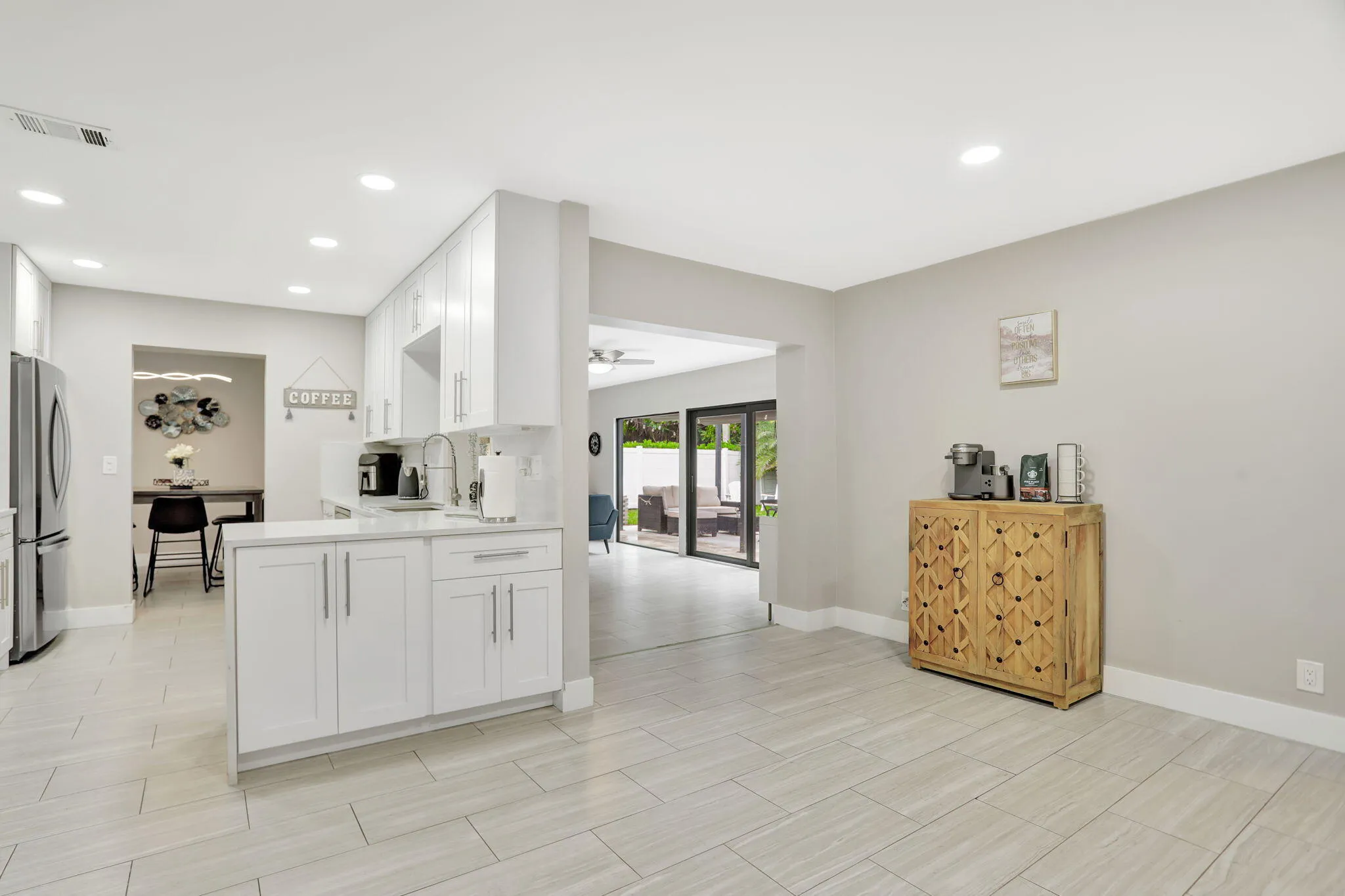 Versatile flex space off the kitchen—ideal for a home office, reading area or additional gathering space