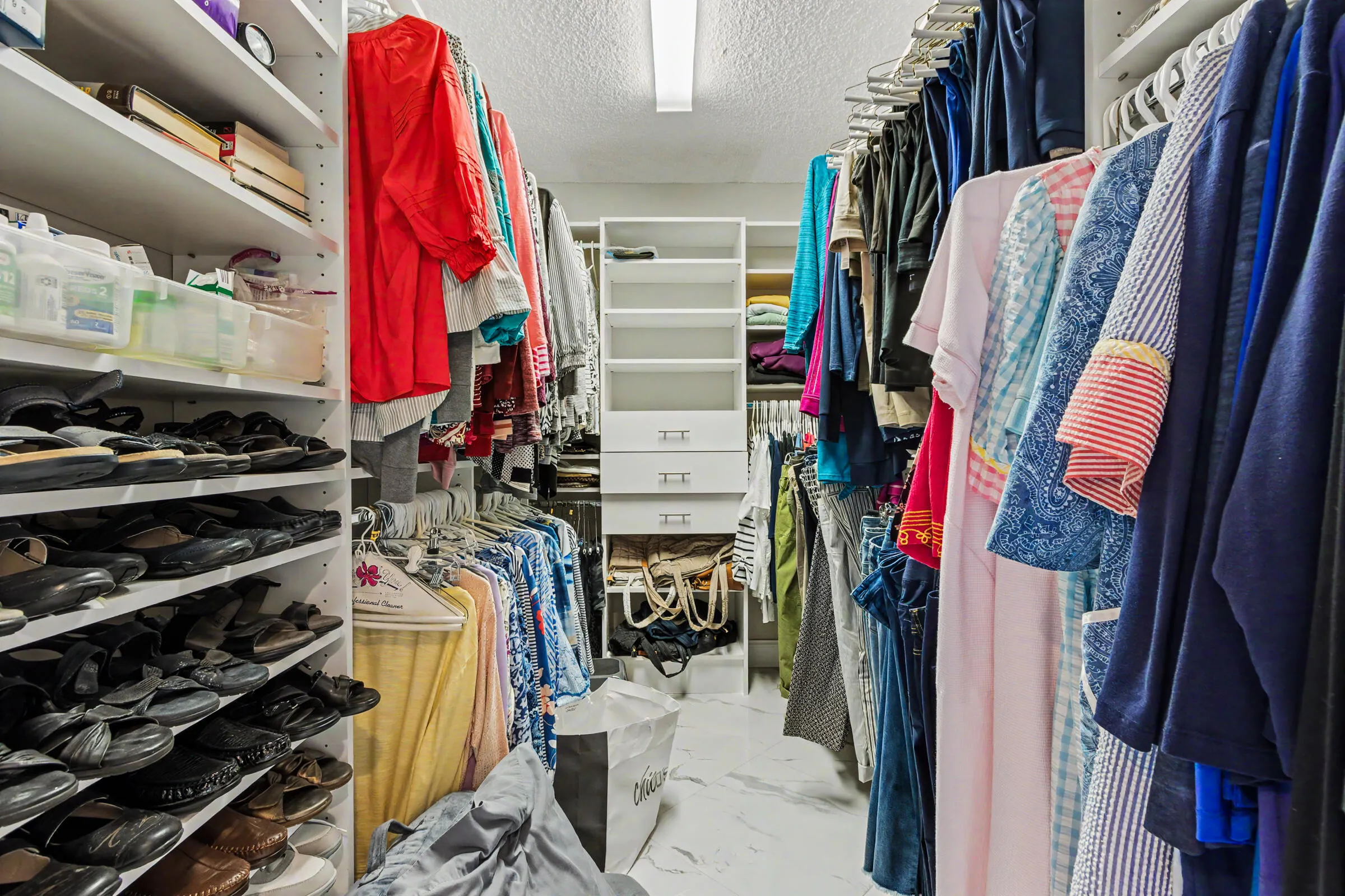 Primary walk-in closet with built-in storage
