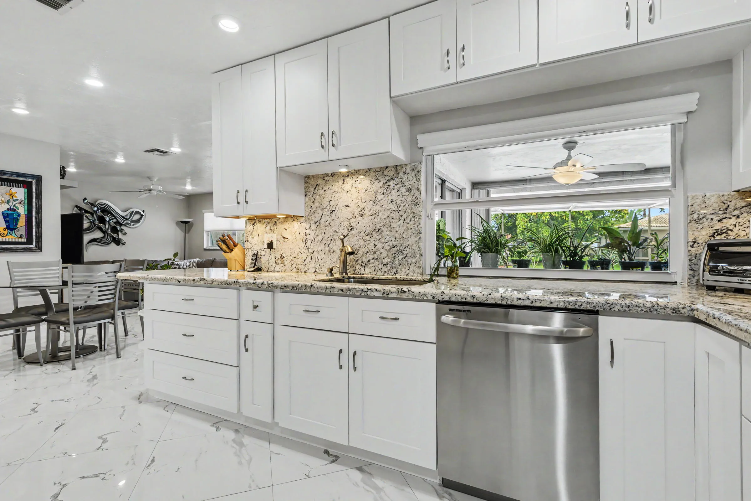 Kitchen leads to family room and eat-in kitchen area.