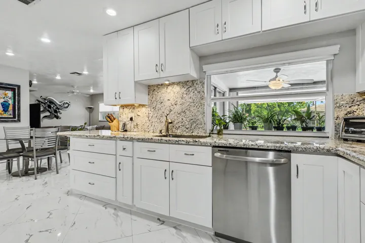 Kitchen leads to family room and eat-in kitchen area.