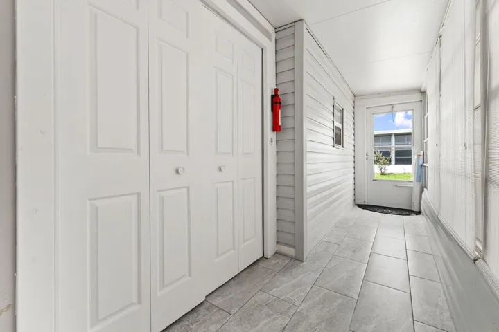 HALLWAY WITH STORAGE - REAR DOOR