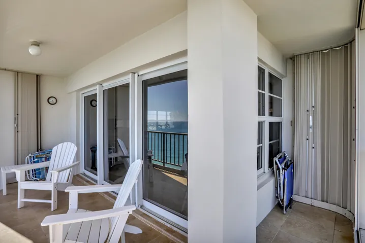 Wrap around NE corner with hurricane shutters to protect patio furniture.