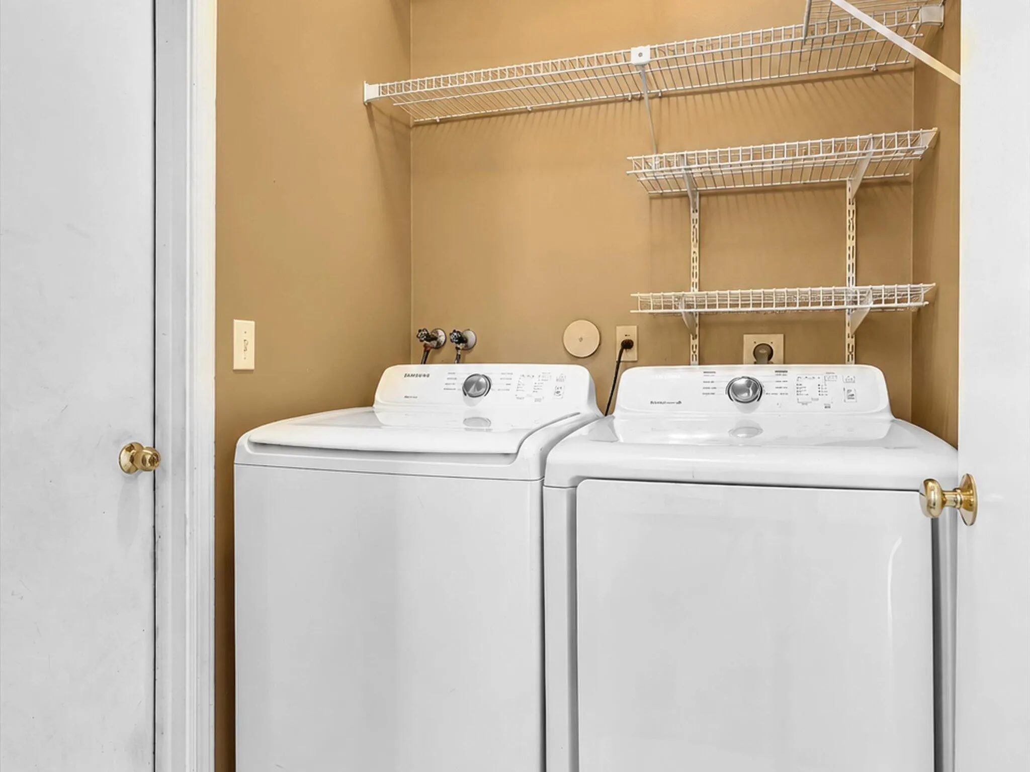 Laundry area featuring wire shelving