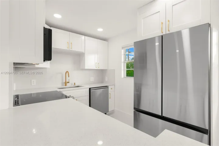 Recessed lighting with smooth finish ceilings. Extra window adds natural lighting.