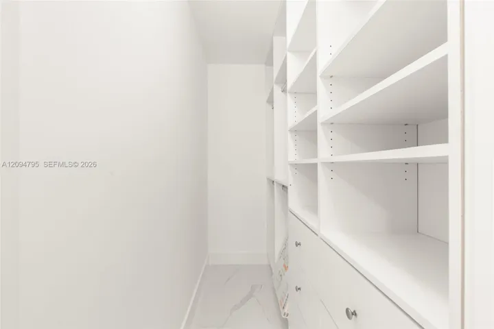 Secondary Bedroom walk in closet with built in storage