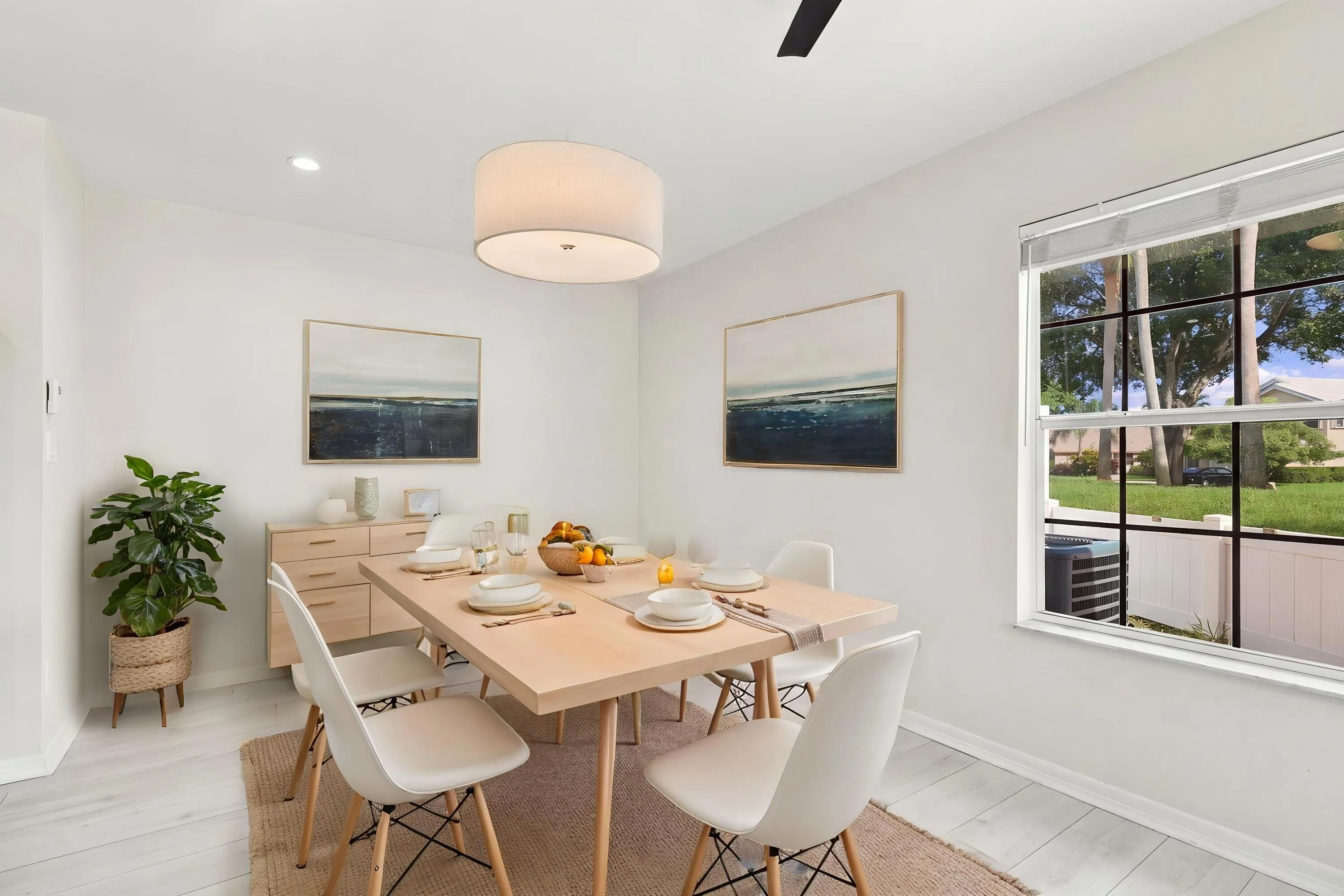The charming eat-in dining area provides a relaxed and convenient setting for casual meals, surrounded by natural light with sliding glass doors opening to the private patio.