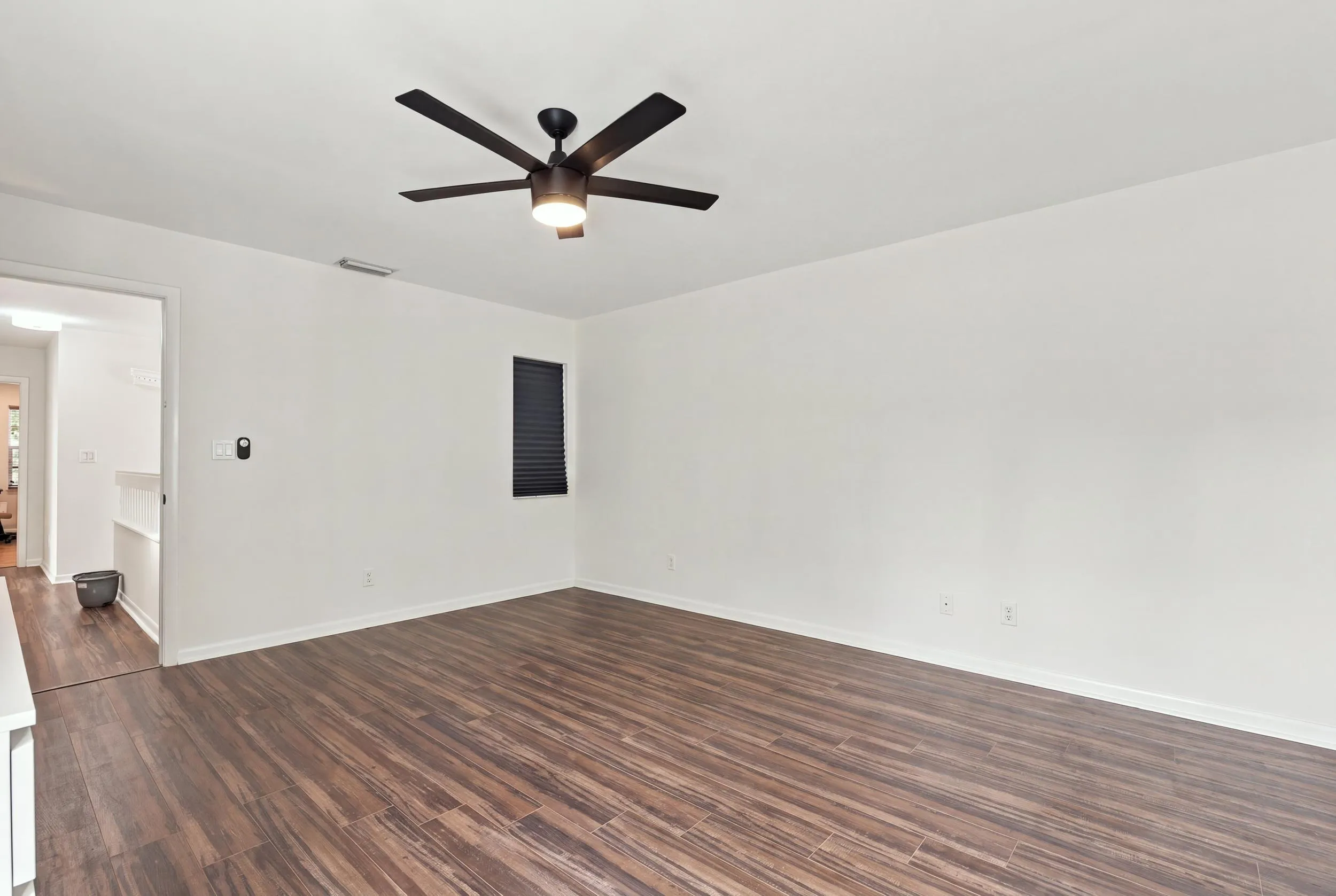 The elegant primary suite offers a private retreat with a beautifully updated bathroom, spacious walk-in closets, and a private balcony overlooking the backyard. It is the perfect place to enjoy your morning coffee while taking in the peaceful setting and mature trees surrounding the community.