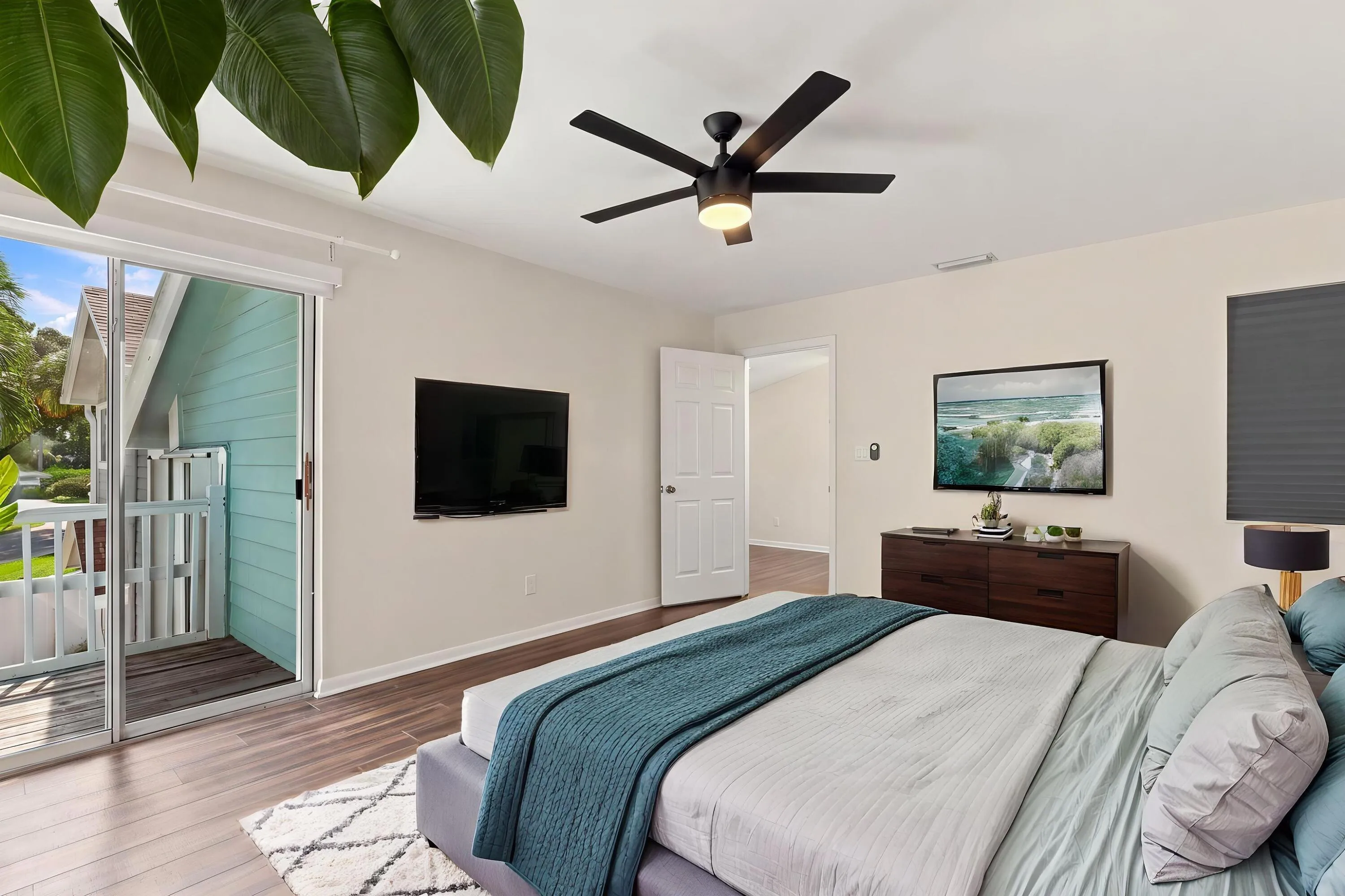 The elegant primary suite offers a private retreat with a beautifully updated bathroom, spacious walk-in closets, and a private balcony overlooking the backyard. It is the perfect place to enjoy your morning coffee while taking in the peaceful setting and mature trees surrounding the community.