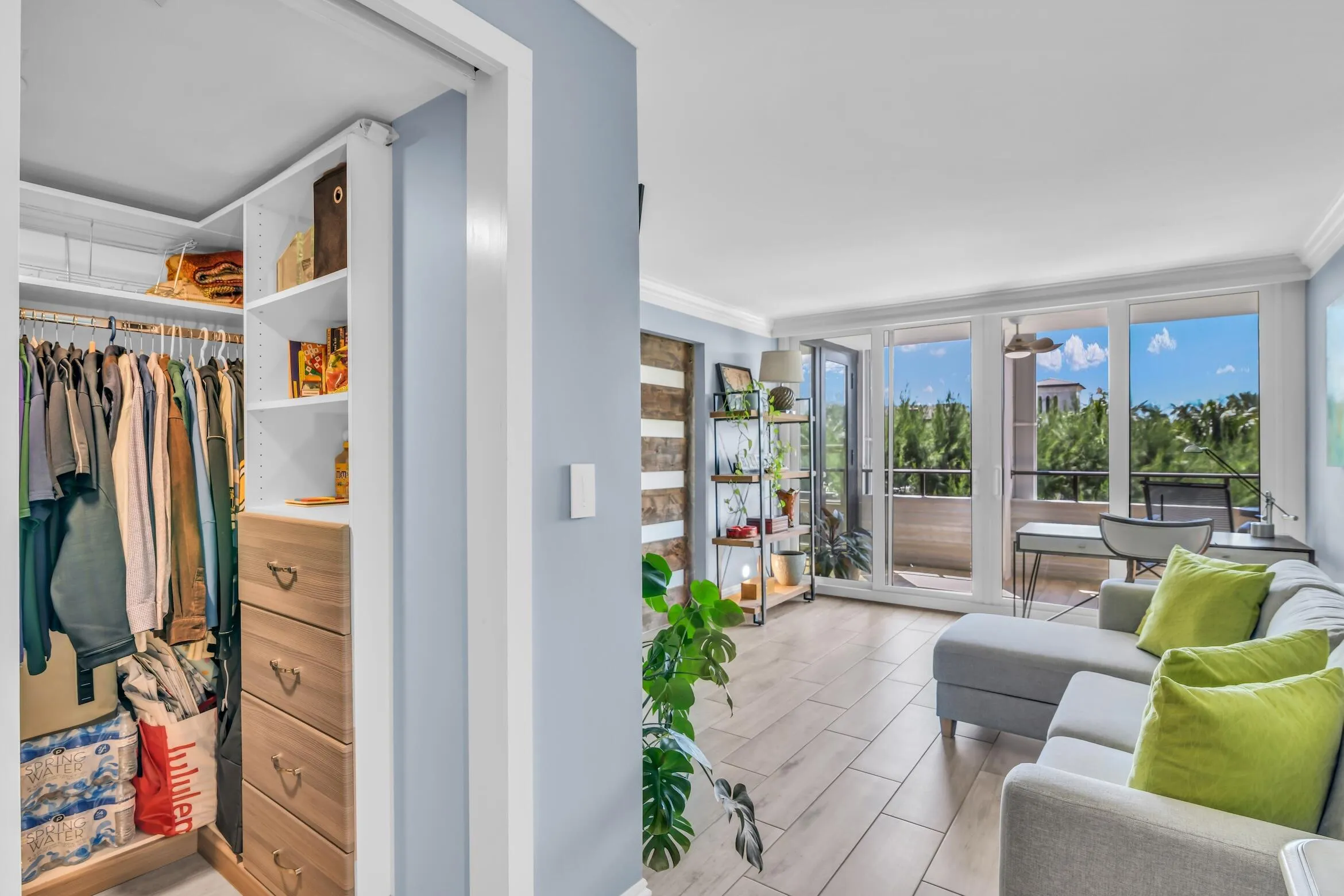 Walk in closet has custom built-ins with ample storage space