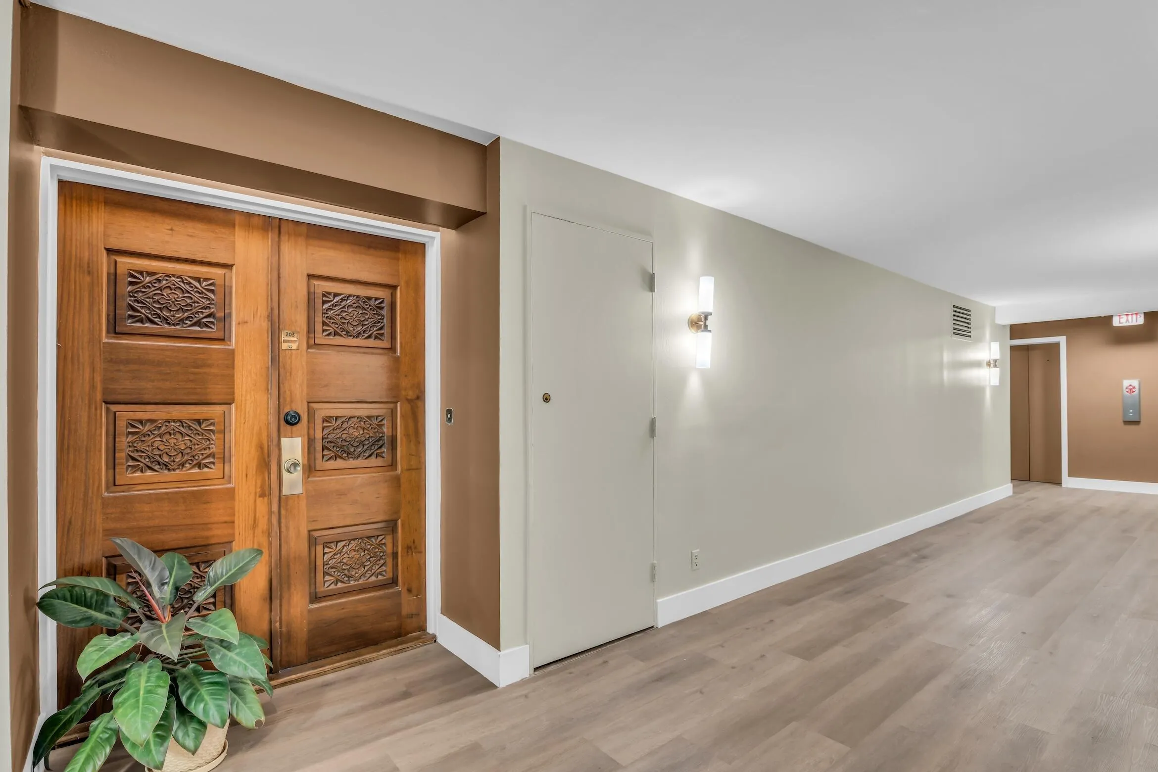 Newly renovated hallway flooring, lighting and paint. Extra wide hallways and double carved wood door entry in every unit