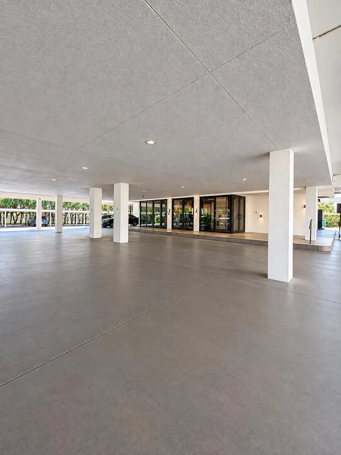 Covered garage parking and main entrance to the building/lobby. A Keypad and or FOB is used to access the lobby.