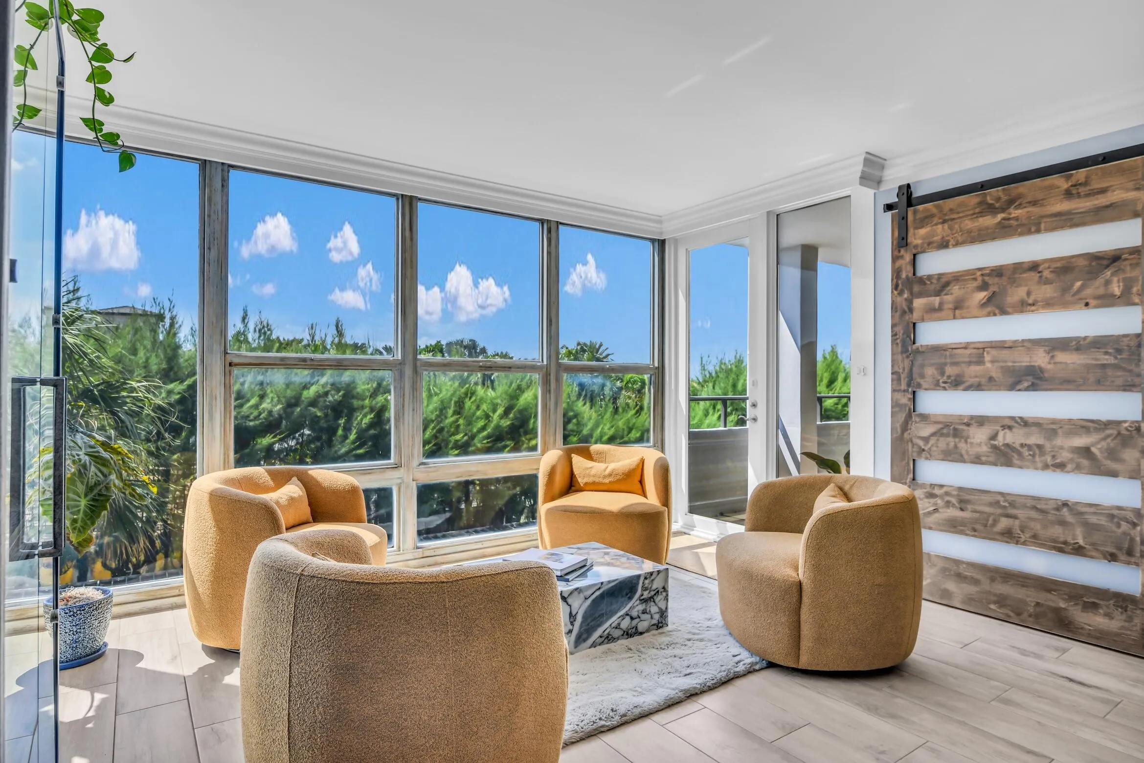 All glass windows and doors in the unit have hidden motorized shades