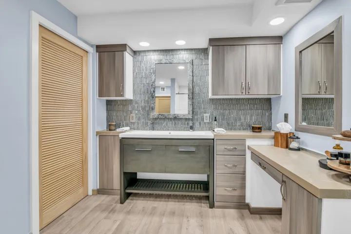 Behind the pocket door is a Washer/dryer combo. There is an additional common laundry room with two sets of large capacity washer/dryer and a sink on each floor