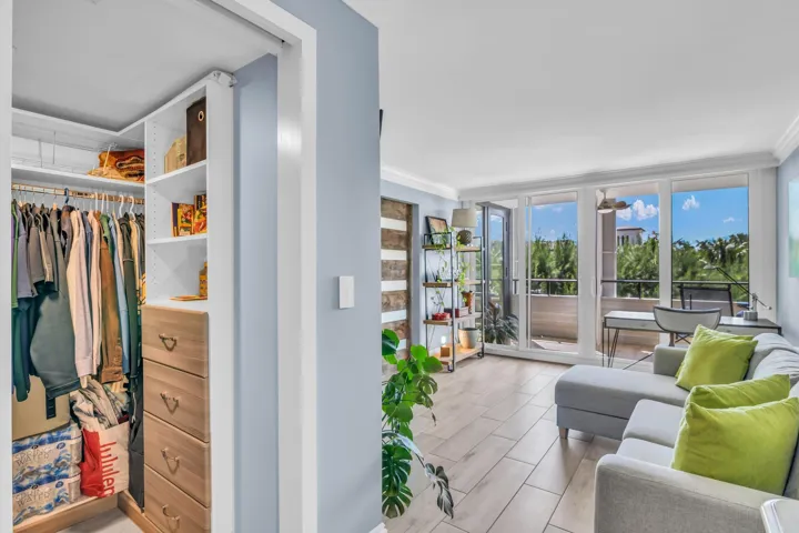 Walk in closet has custom built-ins with ample storage space