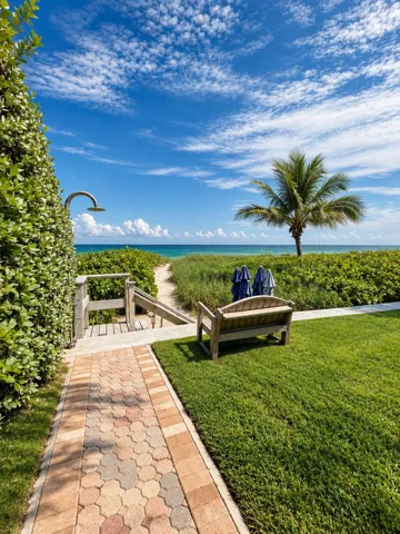 Walkway from the building to the sand. Shower and foot wash located by the steps to/from the sand.