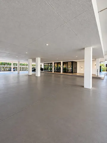 Covered garage parking and main entrance to the building/lobby. A Keypad and or FOB is used to access the lobby.