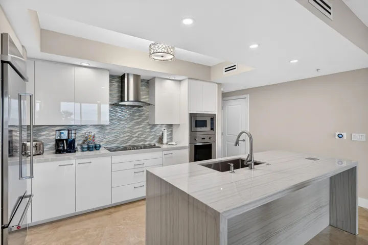 Kitchen also showcases ALL NEW appliances, including a sleek, wall mounted stainless steel ventilation hood that adds a professional touch.