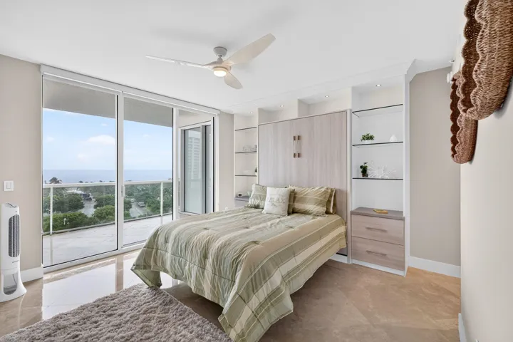 The beautifully appointed guest suite offers access to terrace and it's own en-suite bathroom with walk-in closet providing comfort, privacy and reflects th residence's understated elegance and luxurious coastal lifestyle.
