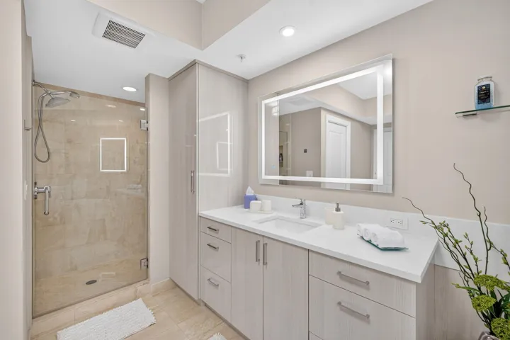 A sleek walk-in shower offers everyday indulgence and elevates the art of relaxation.