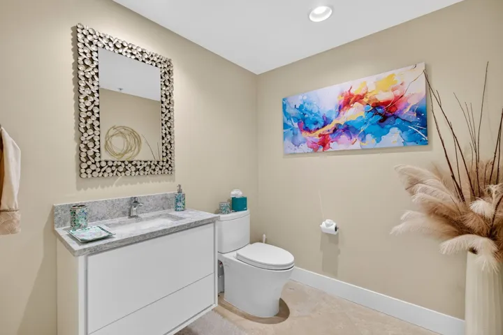 An added touch this beautifully appointed powder room is a sought-after feature not found in every residence.