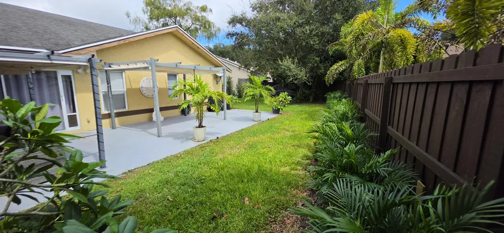 Huge patio perfect for entertaining extends the length of the home.