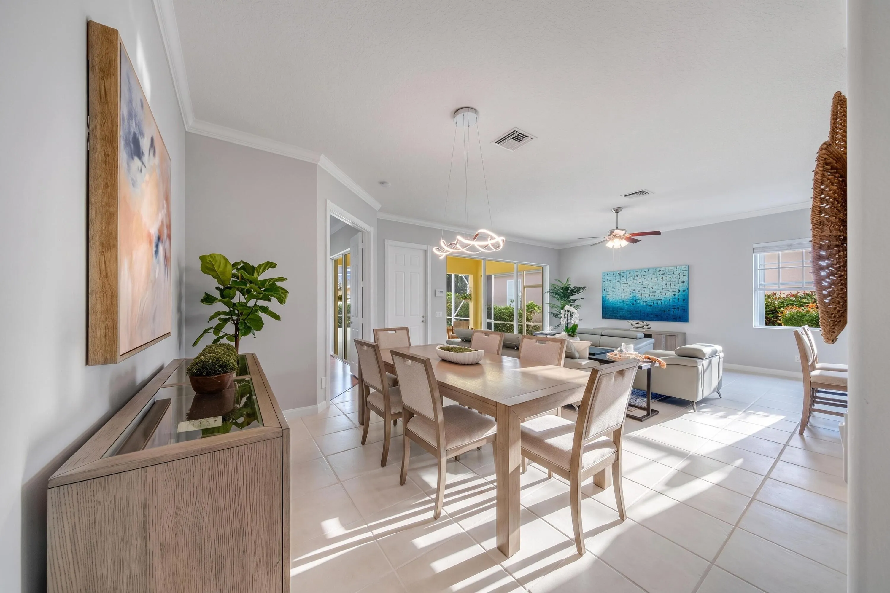 Dining room and sight-lines through the living room and the covered and screened patio