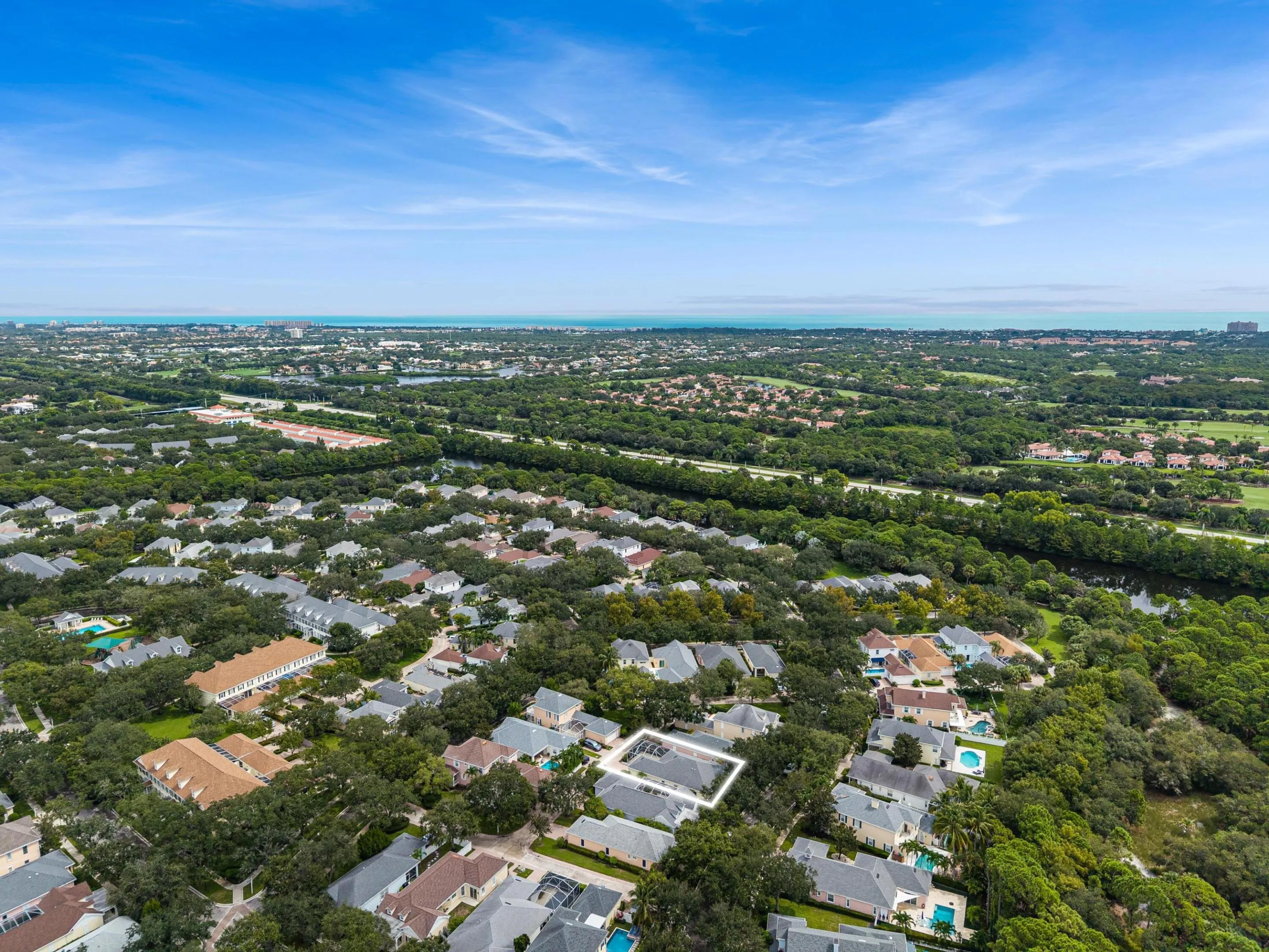 Aerial with the residence outlined, with the neighborhood and Atlantic beyond