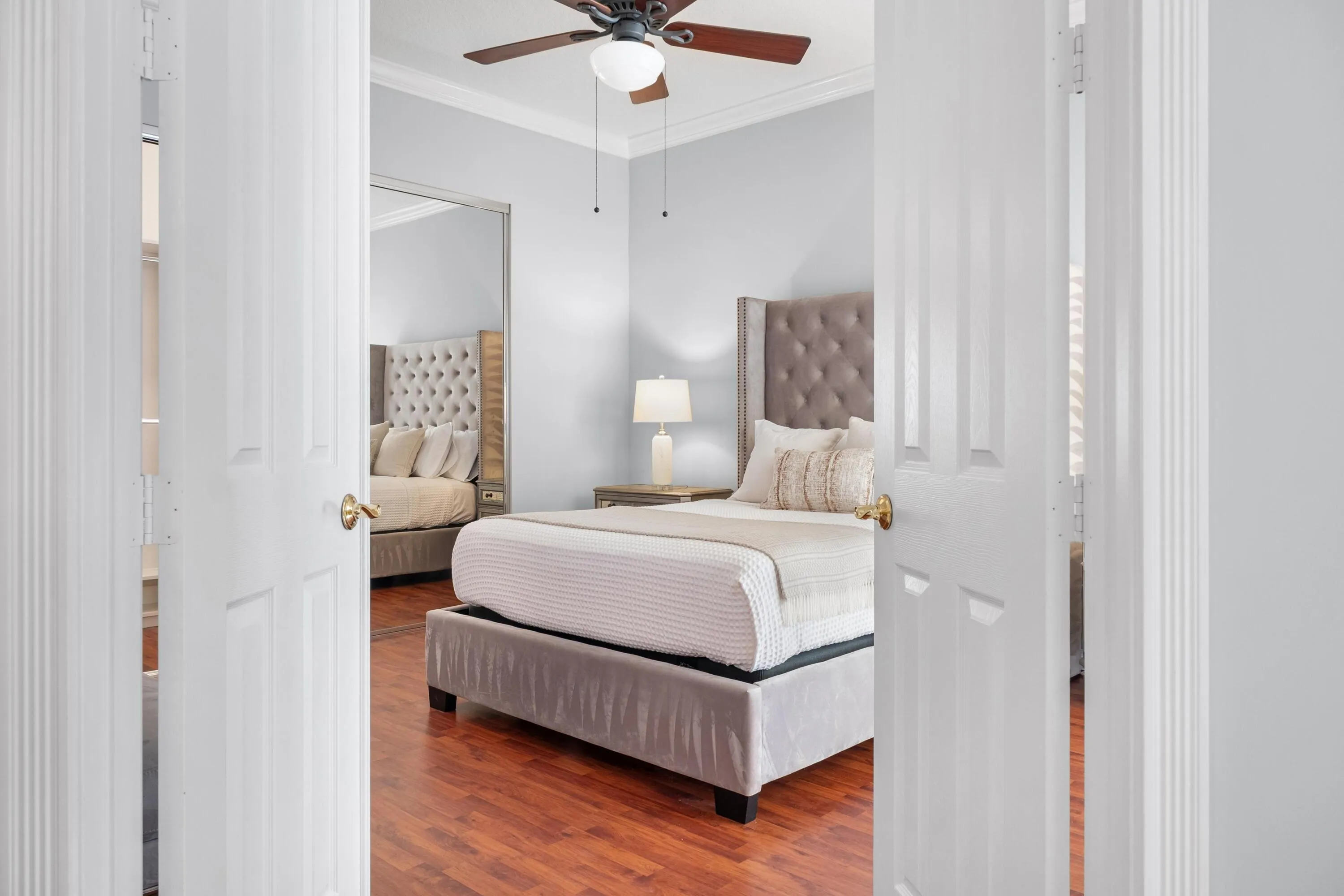 Double doors open to the primary suite