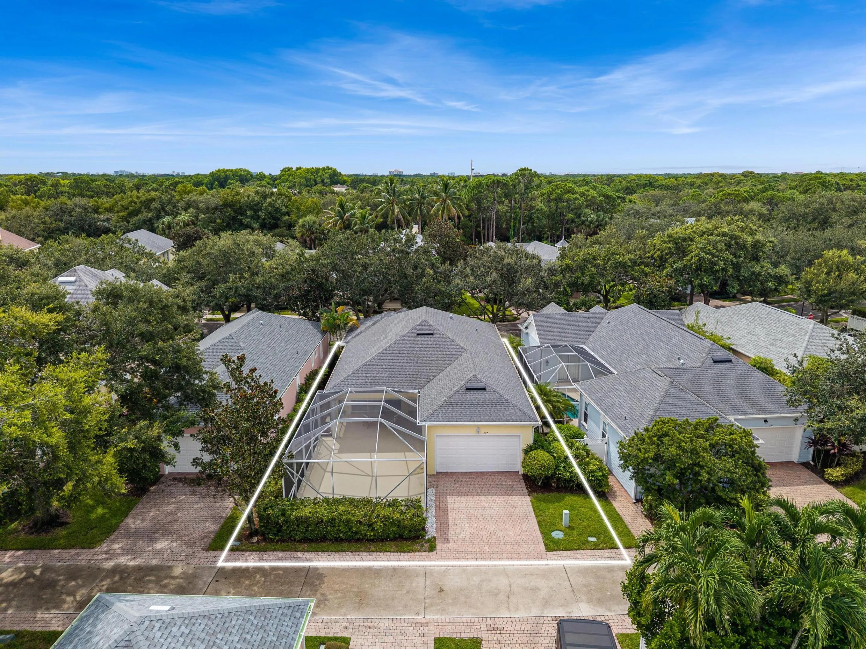 Low aerial with lot lines, showing the homesite, screened patio and garage