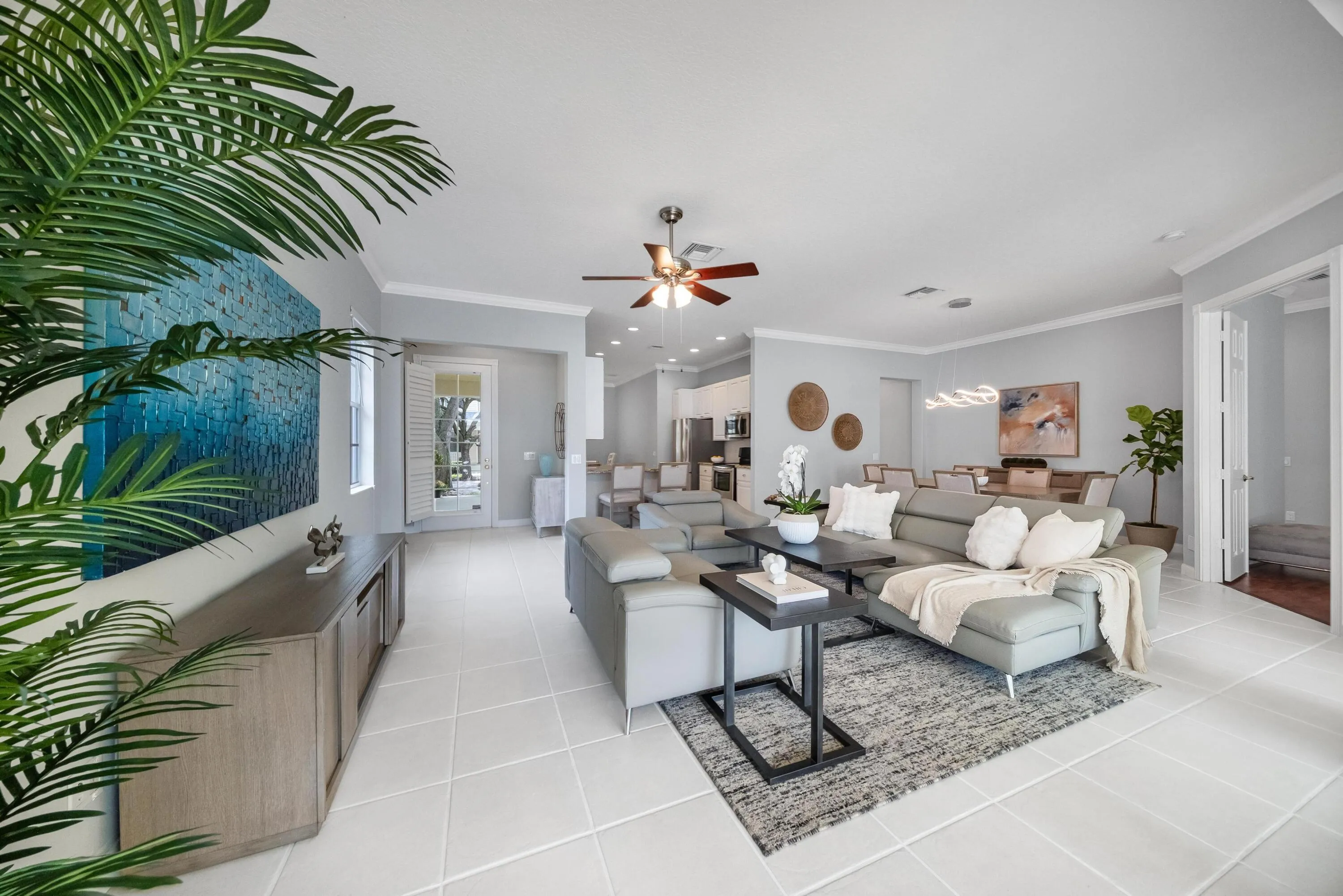 Expansive living room with recessed lighting and tile flooring throughout
