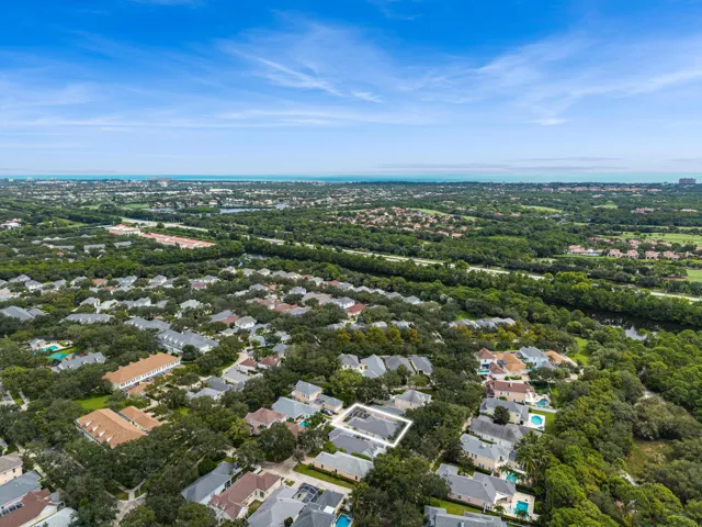Aerial with the residence outlined, with the neighborhood and Atlantic beyond