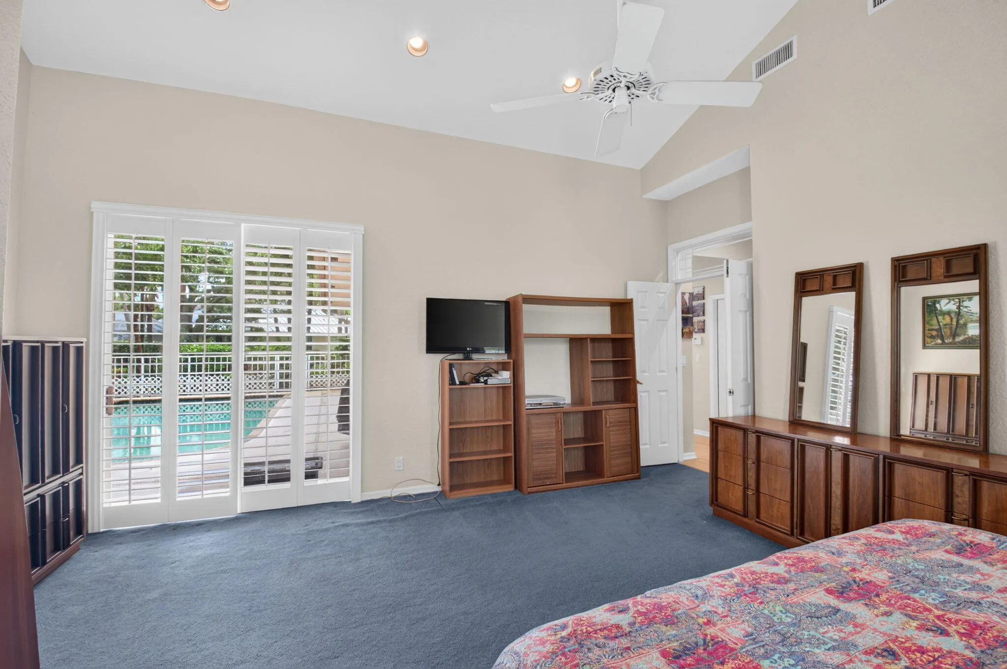 Overlook the pool from the primary bedroom