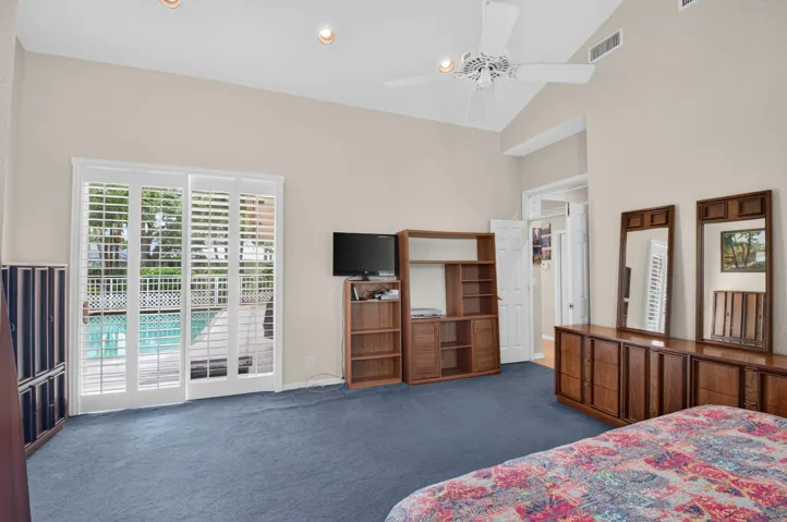 Overlook the pool from the primary bedroom