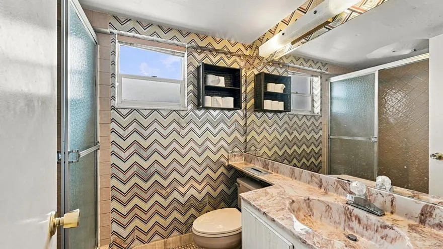 Combined Bath Shower, Full Bathroom, Tile Floor, Vanity, Wallpaper Wall, Full Bathroom, Tile Wall