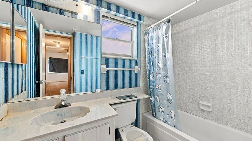 Combined Bath Shower, Full Bathroom, Tile Floor, Vanity, Wallpaper Wall, Full Bathroom, Tile Wall