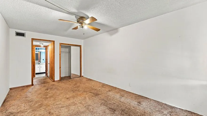 Recessed lighting, wood-finish trim, ceiling fan, and sliding closet door