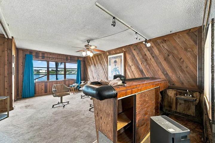 Ceiling Fan, Indoor Bar, Textured Ceiling, Track Lighting, Water View, Waterfront, Wood Wall, Smoke Carbon Monoxide Detector