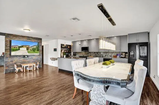 Open-concept living area with wood-finish flooring