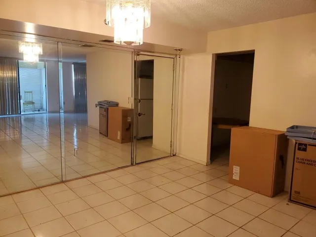 Entrance to Condo. Kitchen on Right. Dining Area on Left.