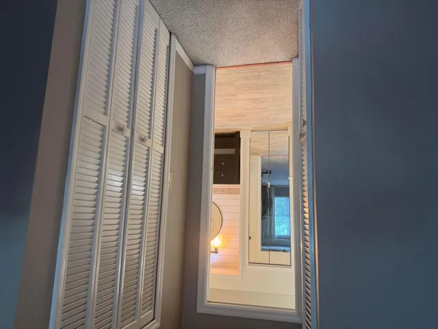 Entry from Primary bedroom to bathroom - double walk in closets