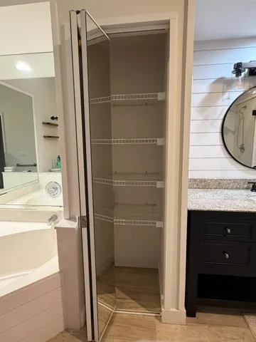Primary bathroom linen closet
