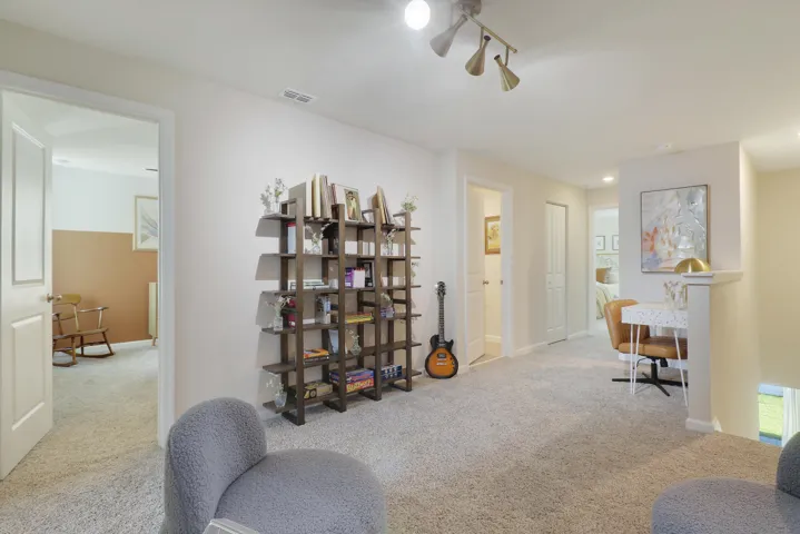 Loft with bookshelf and guitar