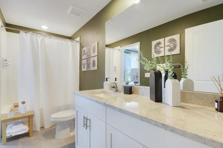 Bathroom with green accent wall