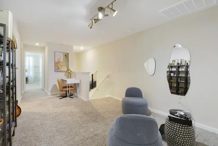 Loft sitting area with bookshelf