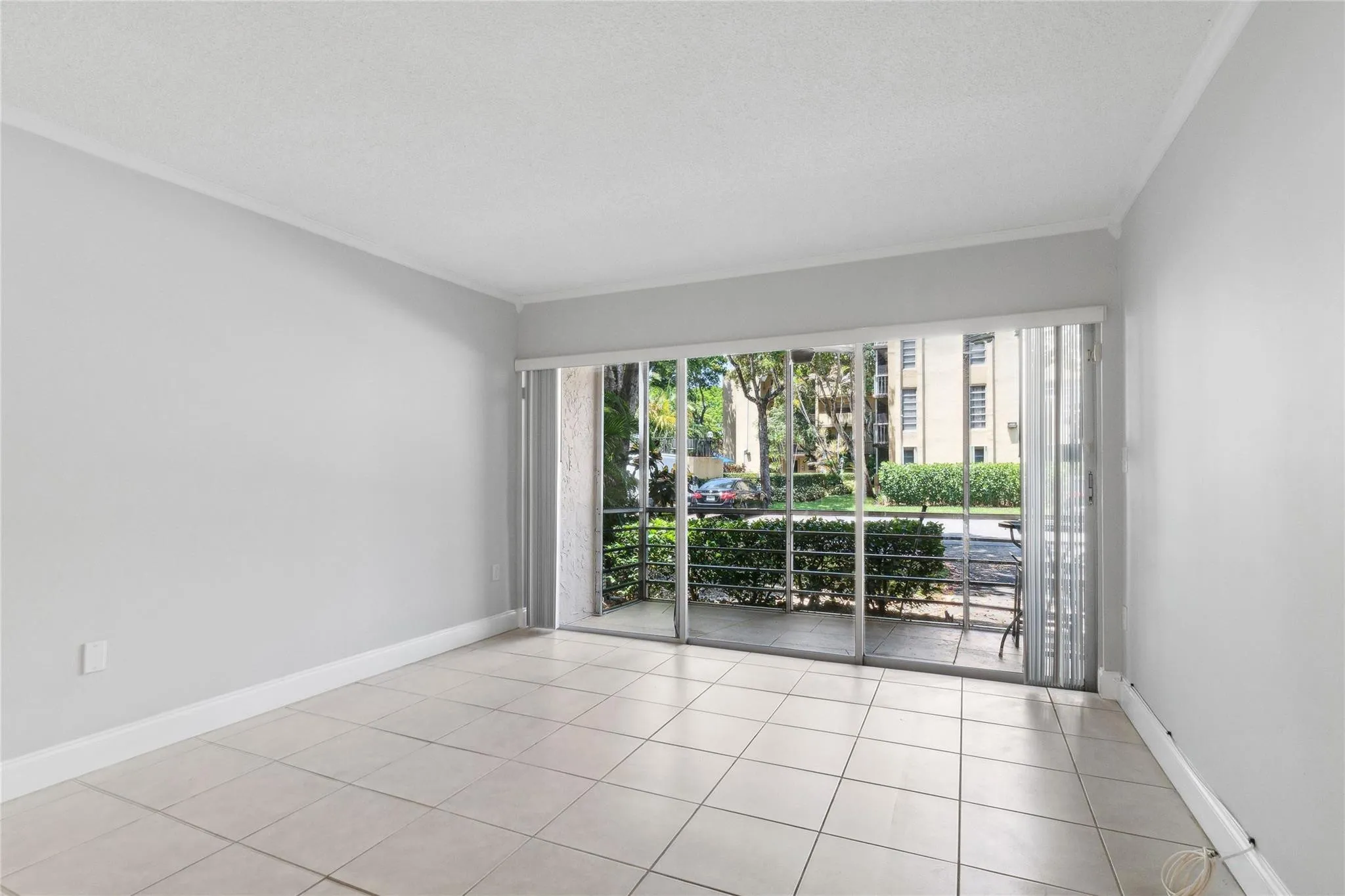 Light and bright living area opens to screened porch