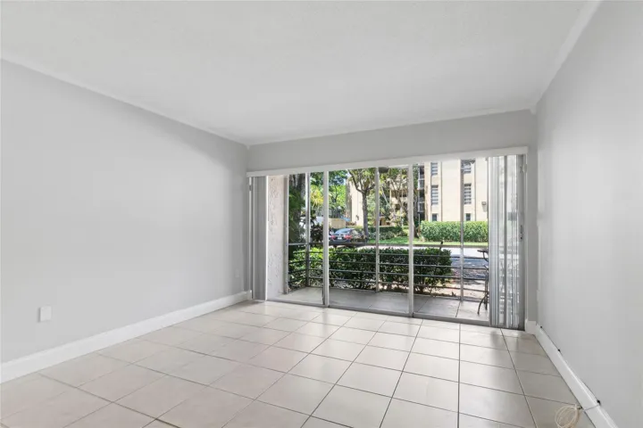 Light and bright living area opens to screened porch
