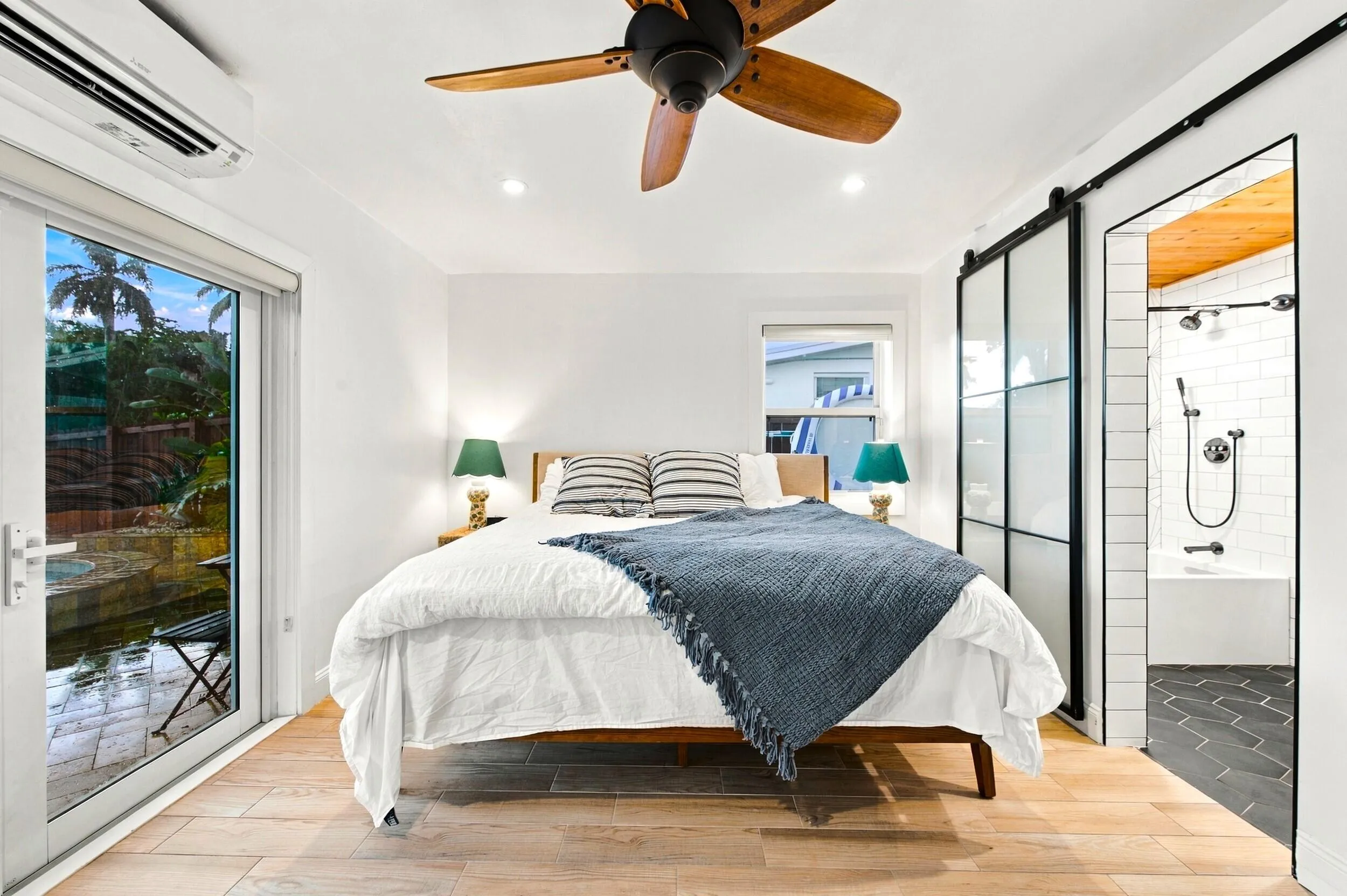 Wood-finish flooring, recessed lighting, and a ceiling fan