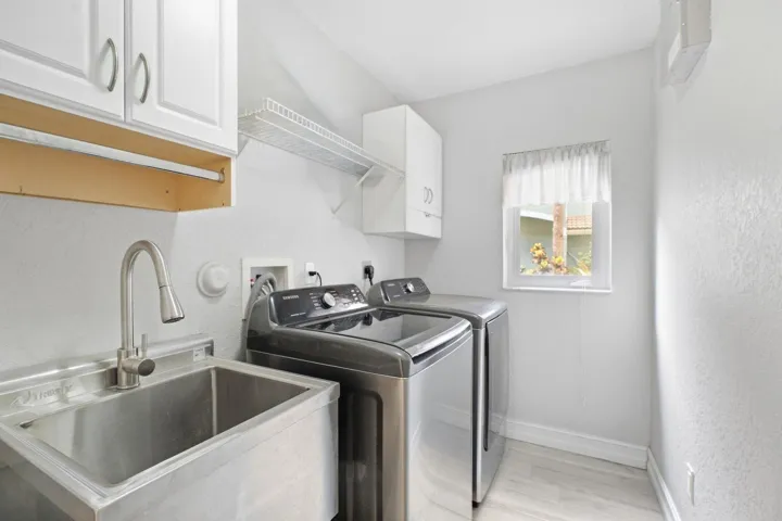 Downstairs, sink and separate laundry room.
