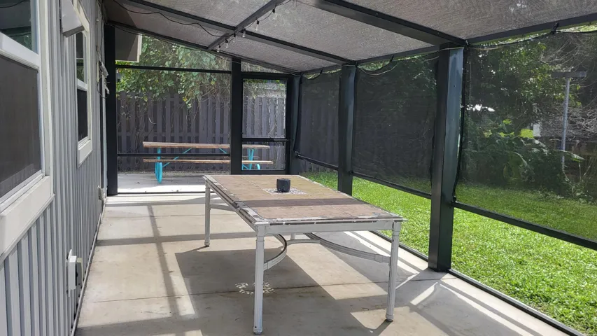 Rear screened porch with UV shades