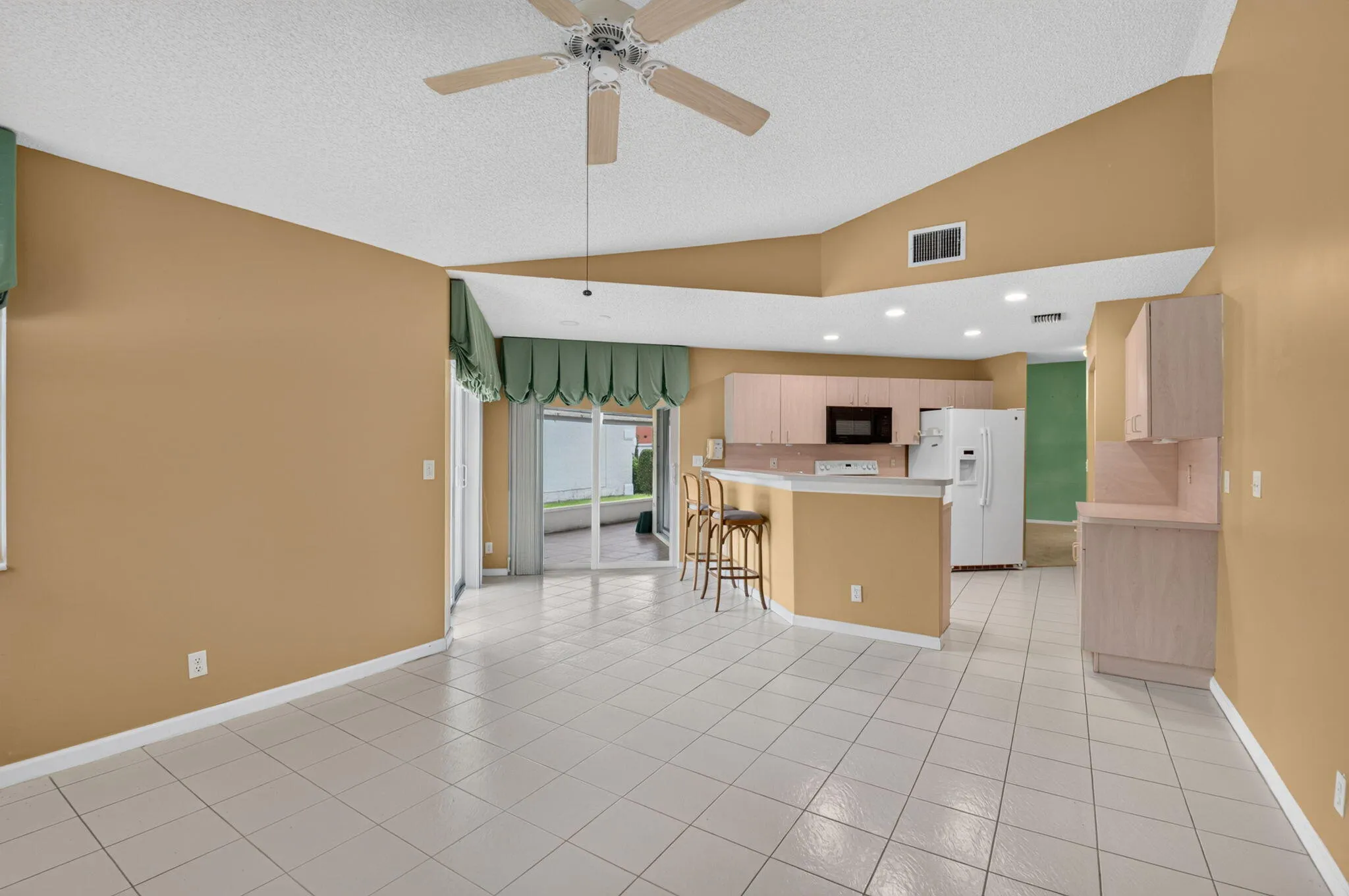 Open-concept living space with a vaulted ceiling.